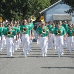 The All-City Band marches down the street.