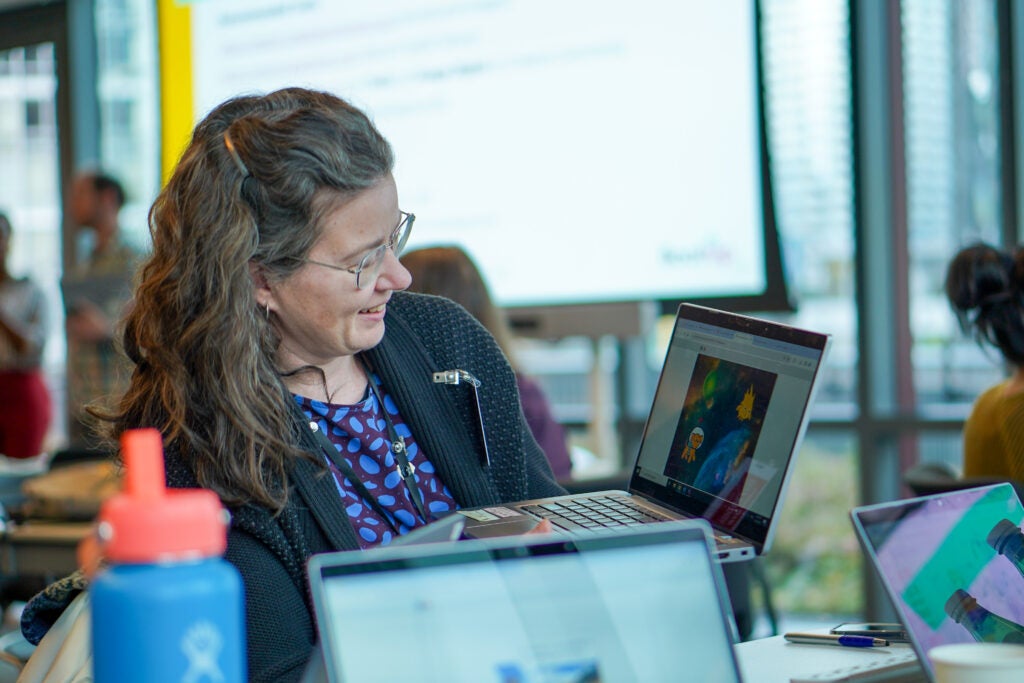 Person sitting at computer during work group with CTE