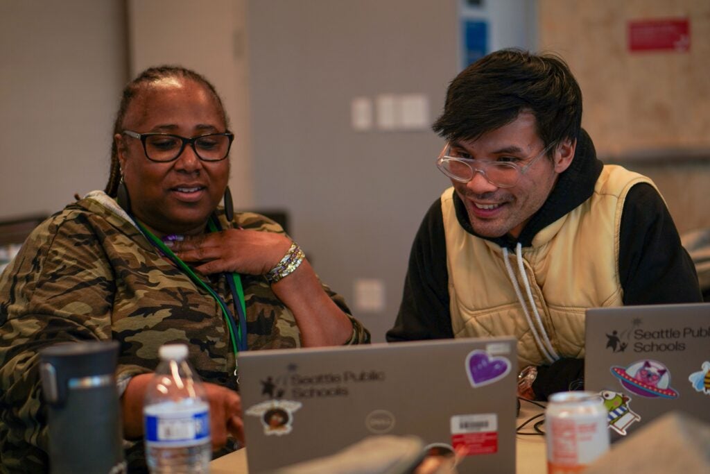 Professional development with industry expert - two people sitting at computers