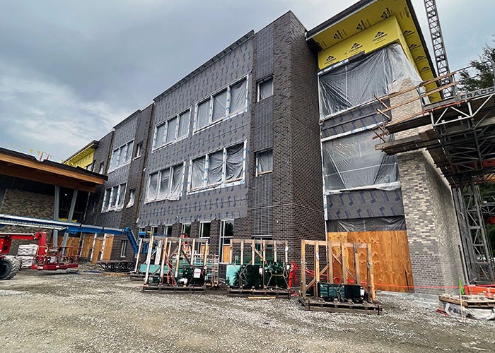 a building under construction with scaffolding and bricks on some of the walls