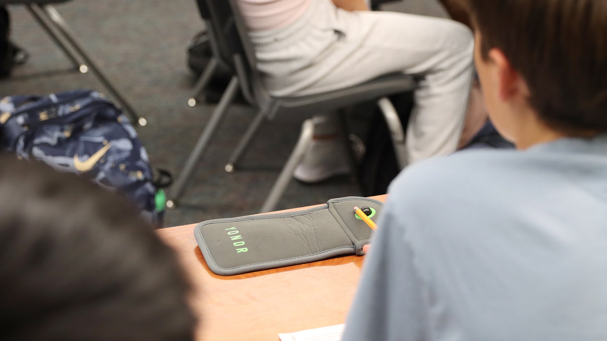 cell phone pouch in a classroom