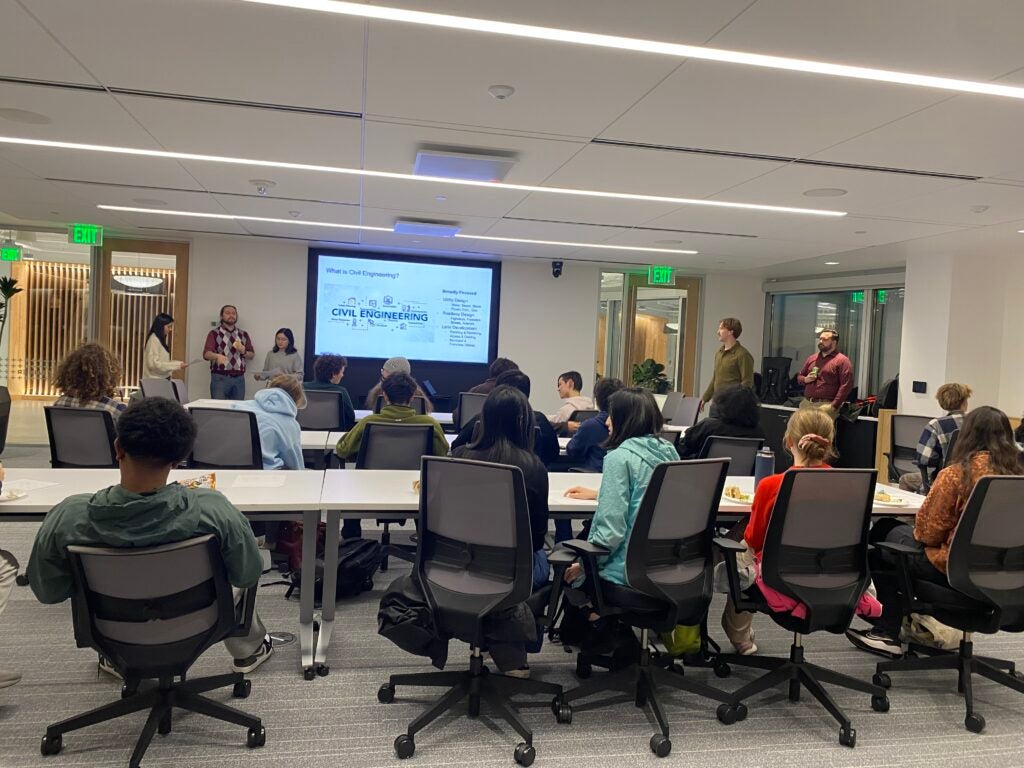 Students sit in front of powerpoint presentation on careers in civil engineering