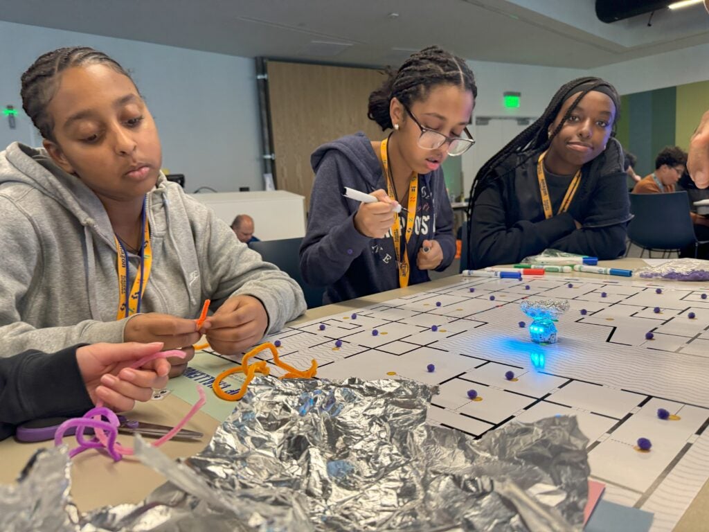 Students engineering robot add-ons for ozobot