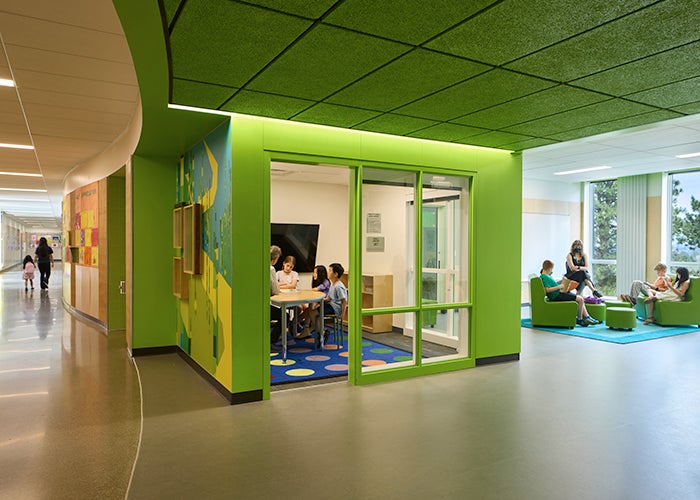 a green pullout area for small group learning next to a learning commons