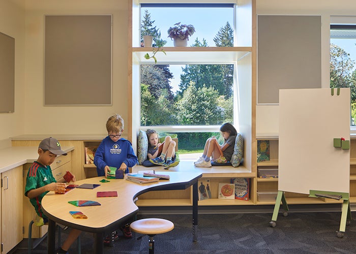 a classroom with students at a curved table