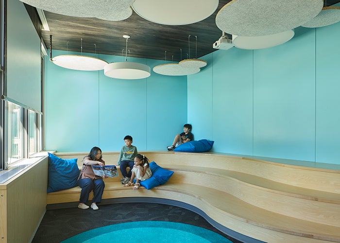 a multi level seating area with blue walls