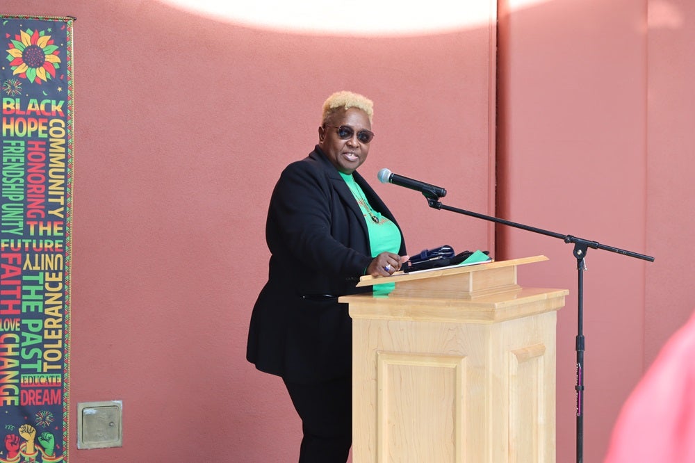 Black Studies Program Manager Anita Koyier-Mwamba gives remarks at black history month flag raising