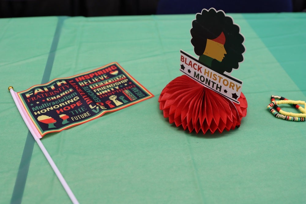 Black History Month decor adorns the table at black history month flag raising