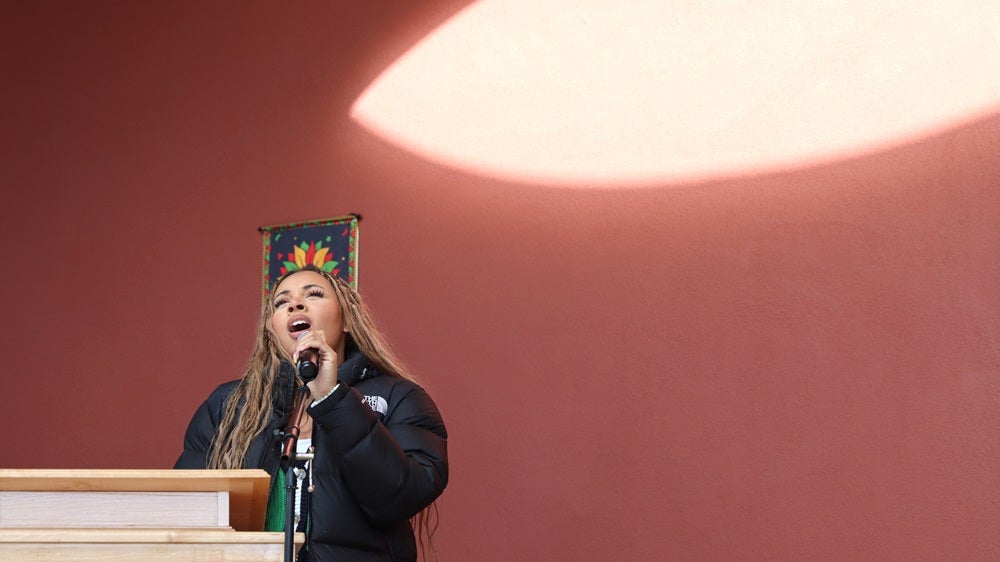 Garfield High School’s Nyshae Griffin sings “Lift Every Voice and Sing” at black history month flag raising