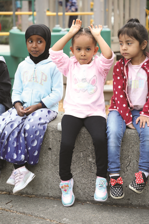 Preschool students outside at recess