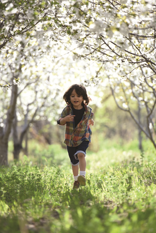 Preschool student running in a field