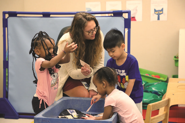 Preschool students and teacher