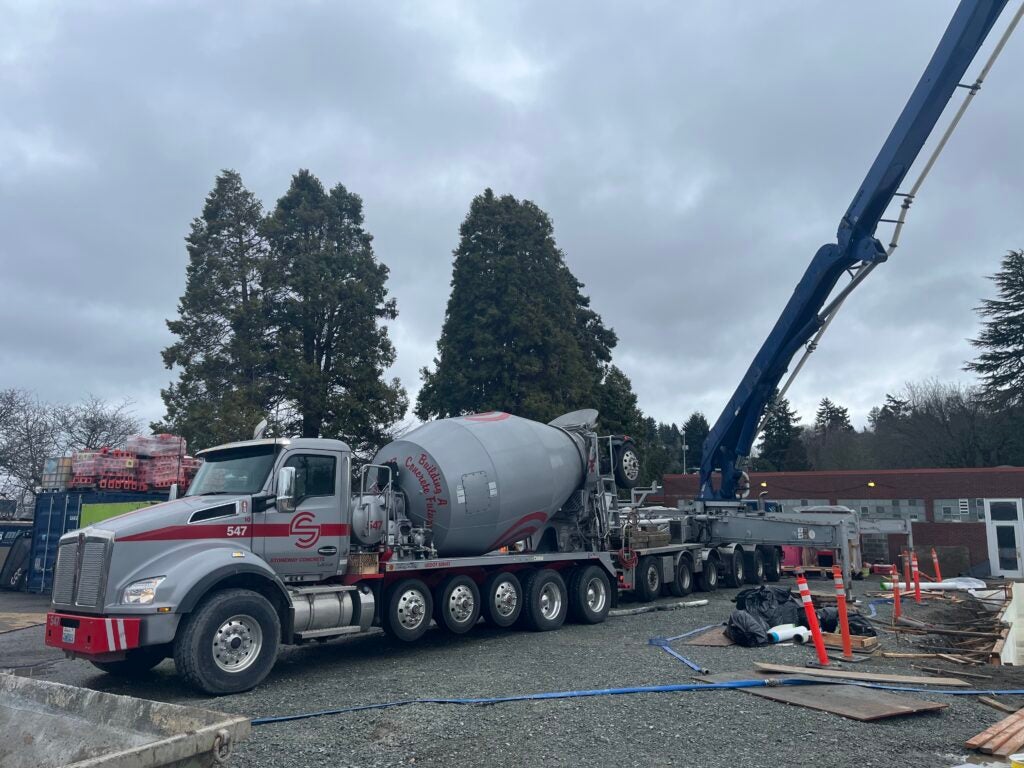 a concrete truck with a pump arm