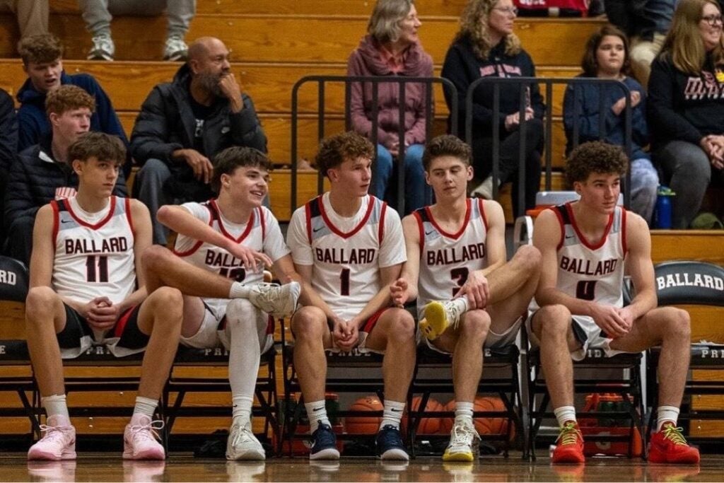 Boys BB on bench in gym