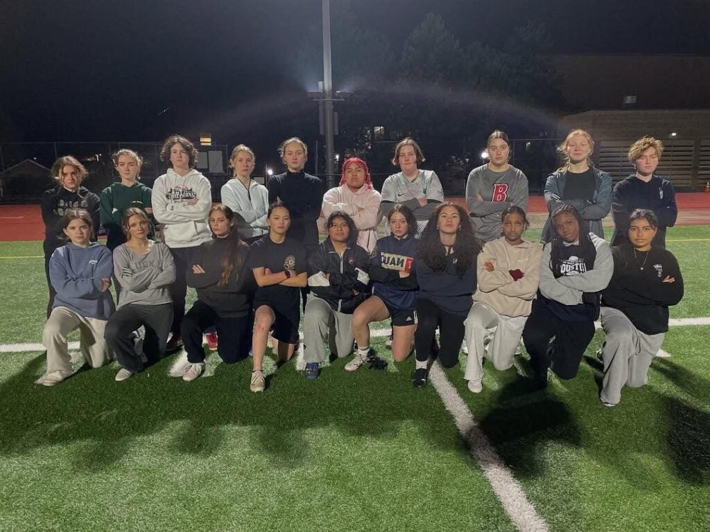 Flag Football student and staff on field.