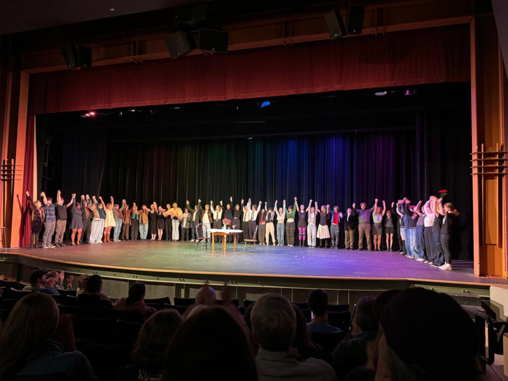 Students on Stage in half circle for bow